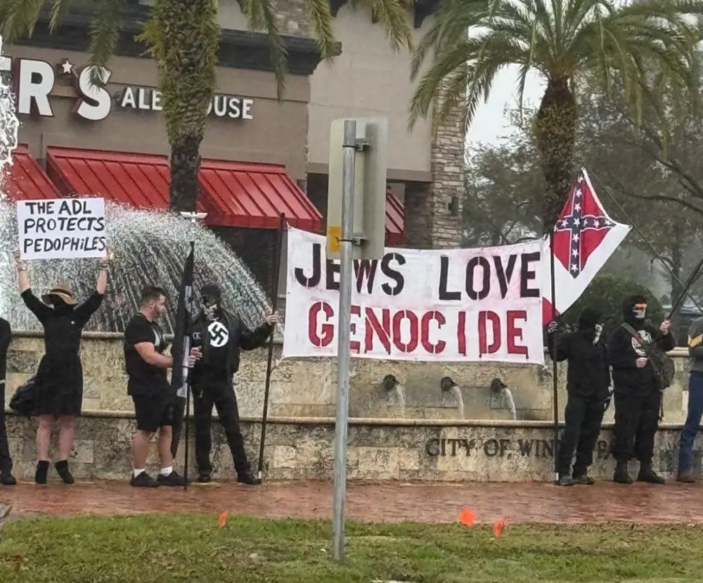 Neo-Nazis holding sign saying ‘Jews love genocide’ protest in Florida park