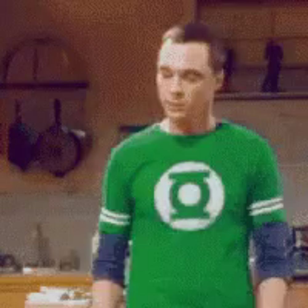 a man wearing a green shirt with a lantern logo on it .