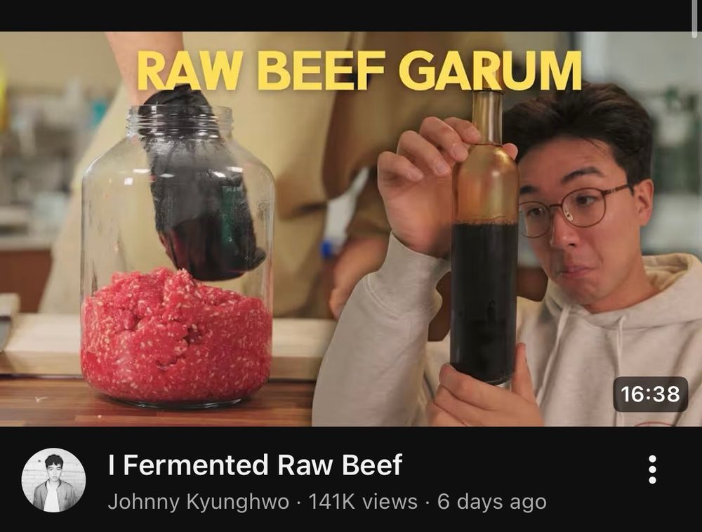 YouTube thumbnail with a glass jar of ground beef and a man holding a bottle of dark brown liquid with the caption “raw beef garum”

The video is titled “I fermented raw beef” by Johnny Kyunghwo