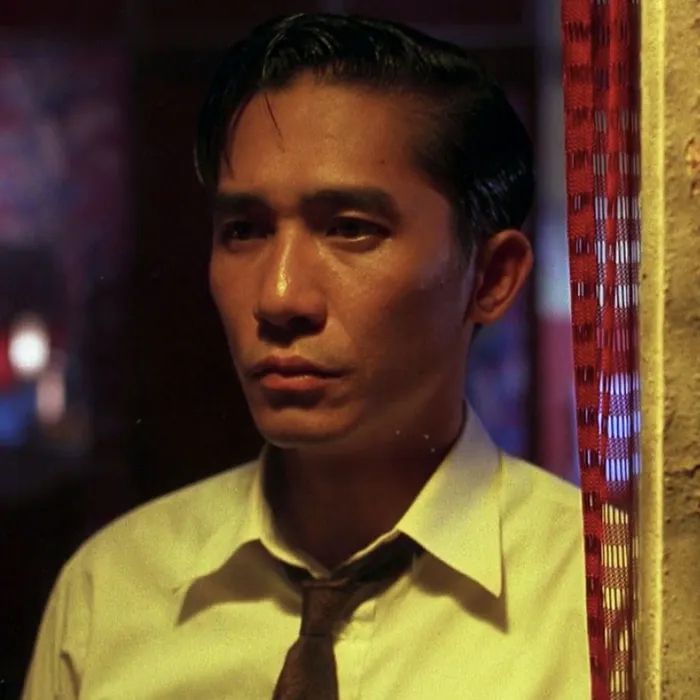 Photo of young Tony Leung - a still from the film In the Mood for Love by Wong Kar Wai. 