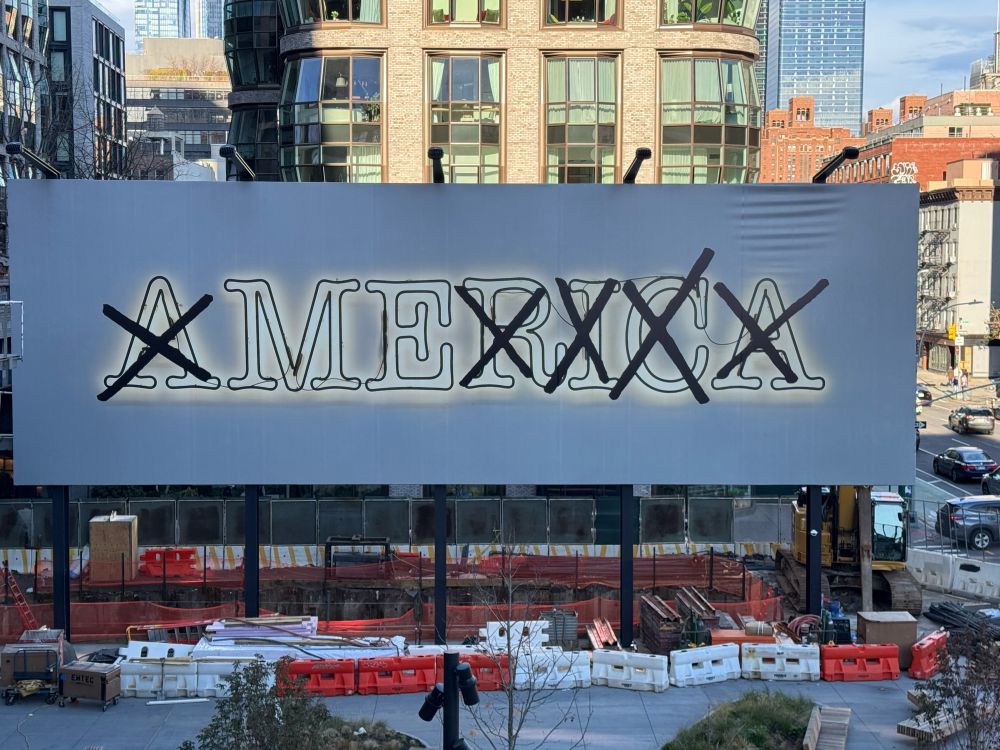 photo if a billboard installation by Glenn Ligon depicting the text “AMERICA” with every letter crossed out except ME. 