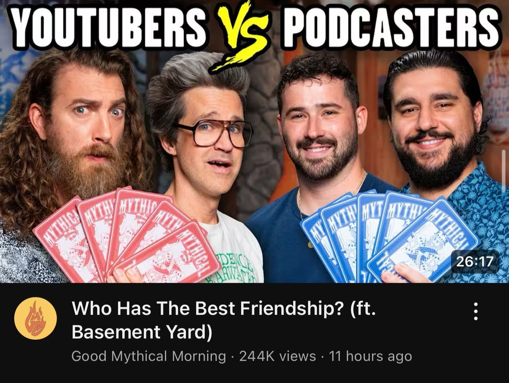Good Mythical Morning video titled Who Has The Best Friendship? (ft. Basement Yard). The thumbnail is Rhett, Link, Joe, and Frank holding up red and blue cards. 