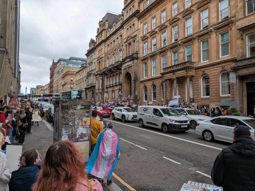 A large trans rights protest across two sides of the road at the EHRC in Glasgow 