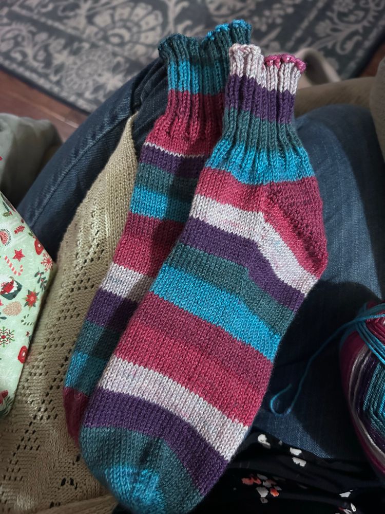 A self striping vanilla sock with a short 2x2 ribbed cuff. 