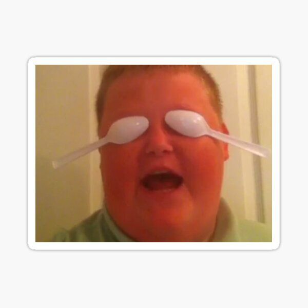 An image from an old Vine. A young man with spoons covering his eyes. He's saying he's blocking out the haters. 