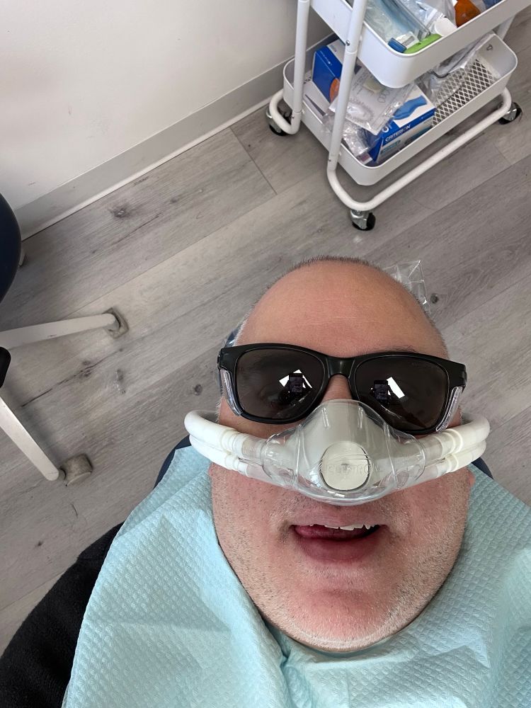 Me in a dentist chair getting nitrous.