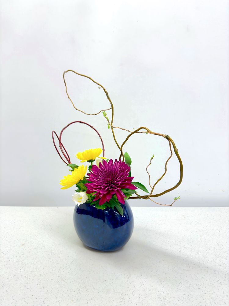 Colorful Japanese style floral arrangement on a white background 