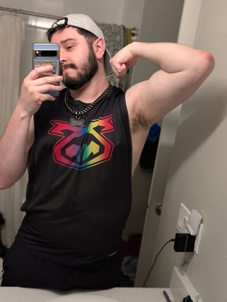 Human Frost Pit. You can see his new nipple piercings through his tank top.