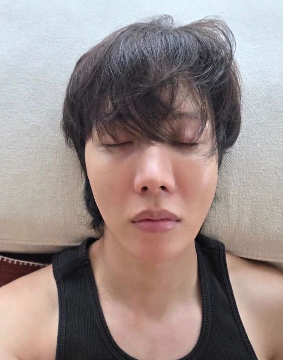 hobi’s recent insta story of him lying on the bed (?) with his eyes closed, hair fluffy and shoulders bare (black sleeveless top)