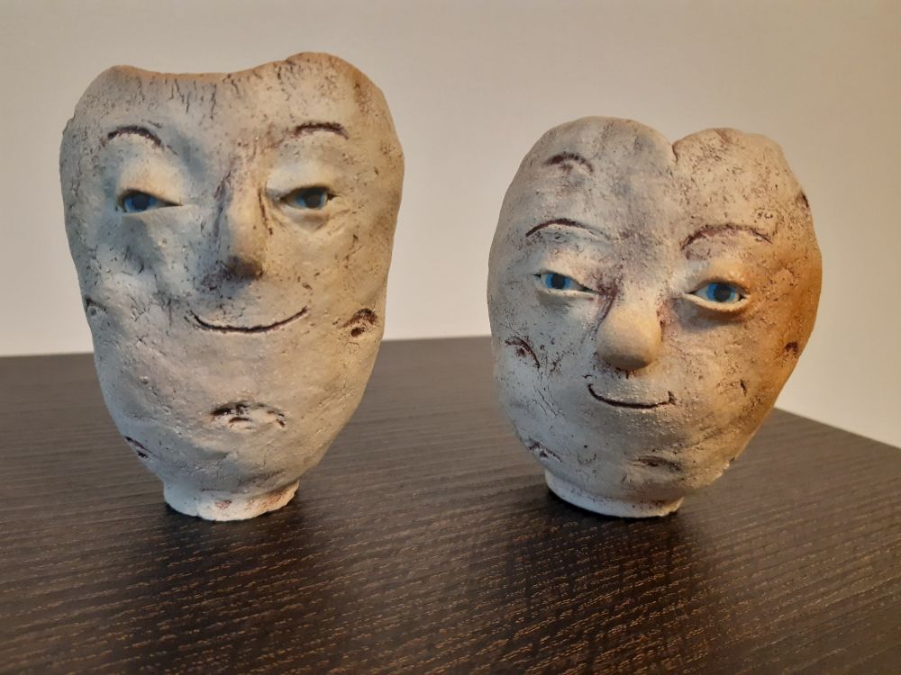 two, potato-shaped ceramic vessels