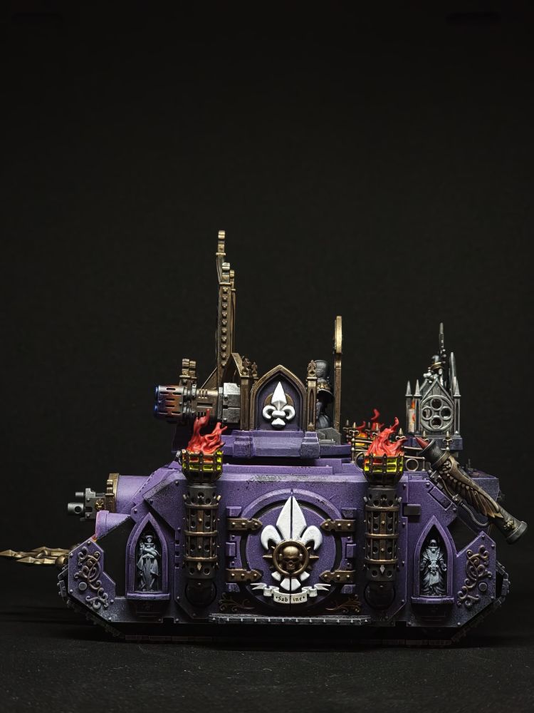 Painted Immolator, left, with heat-marked meltas. Color scheme is in purple and bronze.