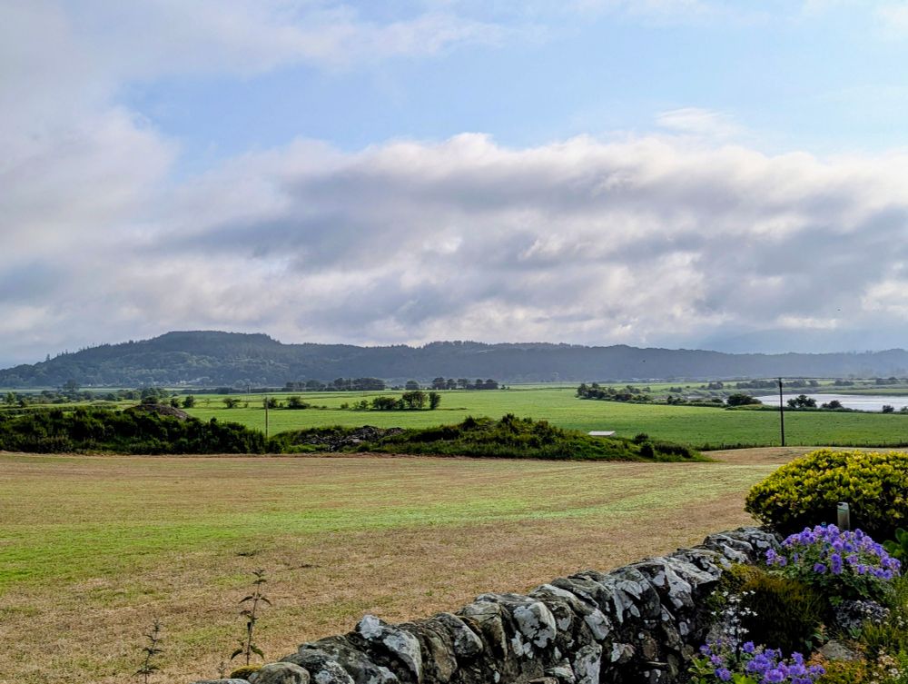 Sunshine on the valley this morning with some clouds in the otherwise blue sky.