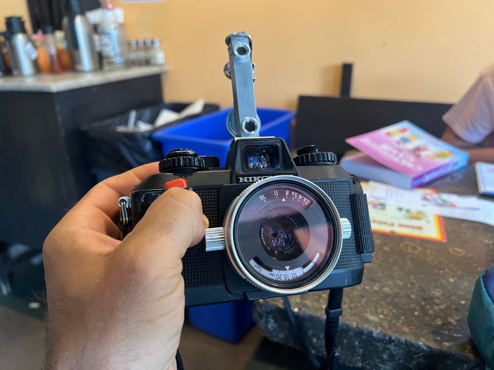 The Nikonos held in my hand with a rangefinder attached to the cold shoe. 