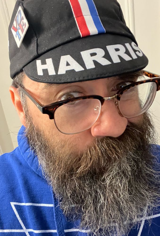 Selfie wearing my Harris cycling hat with a “vote” pin that my daughter made in 2020. 