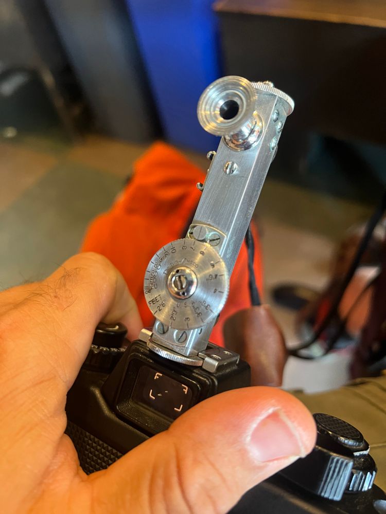 The back of the dejur rangefinder mounted on the cold shoe. 