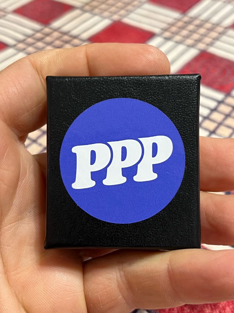 A small jewelry box with a PPP label. 