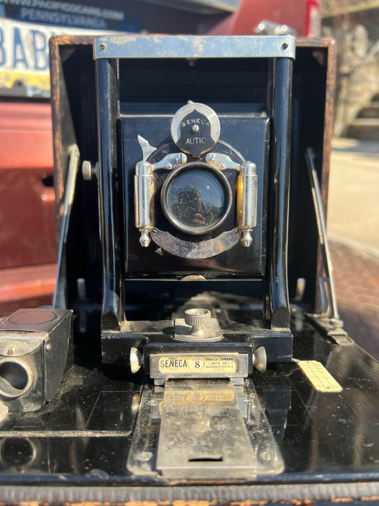 A head on view of the Seneca 8, showing its nicer Autic pneumatic shutter after I cleaned it up and got it operating smoothly again. Also visible is the nice Seneca 8 tag below the front standard. 