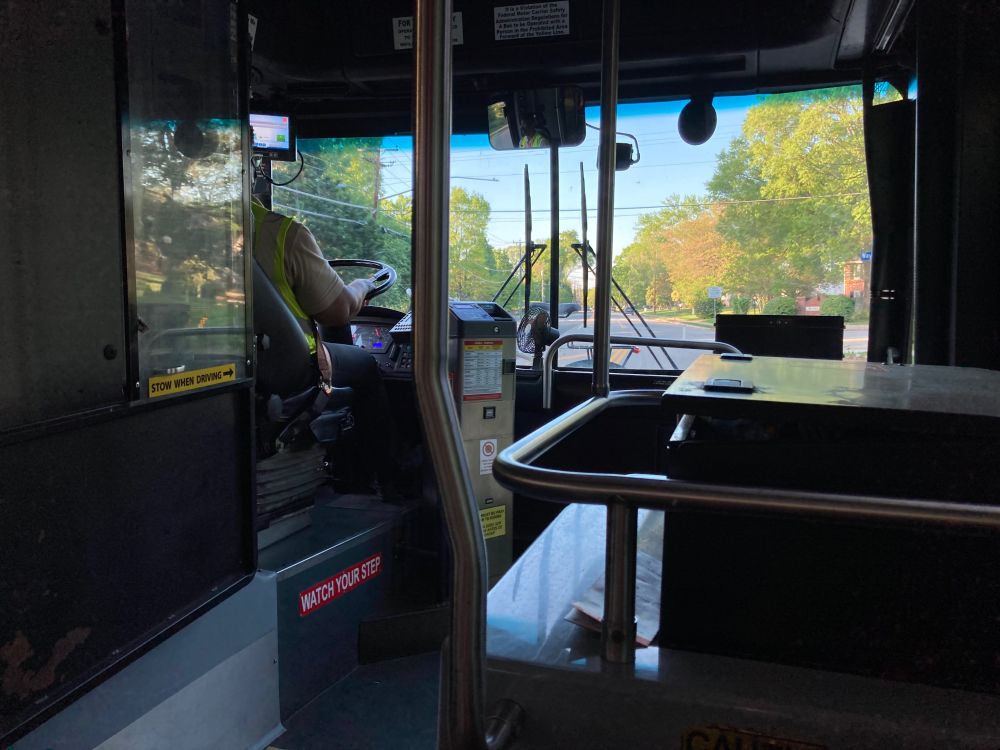View from inside a city bus, showing the bike riding in style on the front.