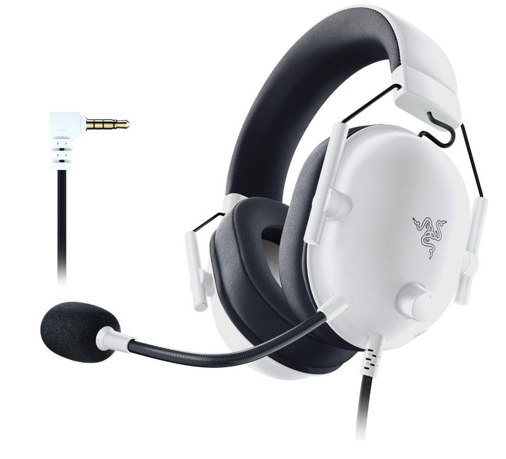 Das Bild zeigt ein Gaming-Headset von Razer in weiß-grauer Ausführung. Es handelt sich um ein Over-Ear-Headset mit folgenden Merkmalen:

- Weißes Gehäuse mit schwarzen Ohrpolstern und Kopfbügel
- Abnehmbares Mikrofon mit schwarzem Schaumstoffüberzug
- 3,5mm Klinkenstecker für den Anschluss
- Das Razer-Logo auf der Außenseite der Ohrmuscheln
- Verstellbarer Kopfbügel und gepolsterte Ohrmuscheln für hohen Tragekomfort