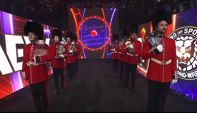 a bunch of wrestlers holding Mone's titles