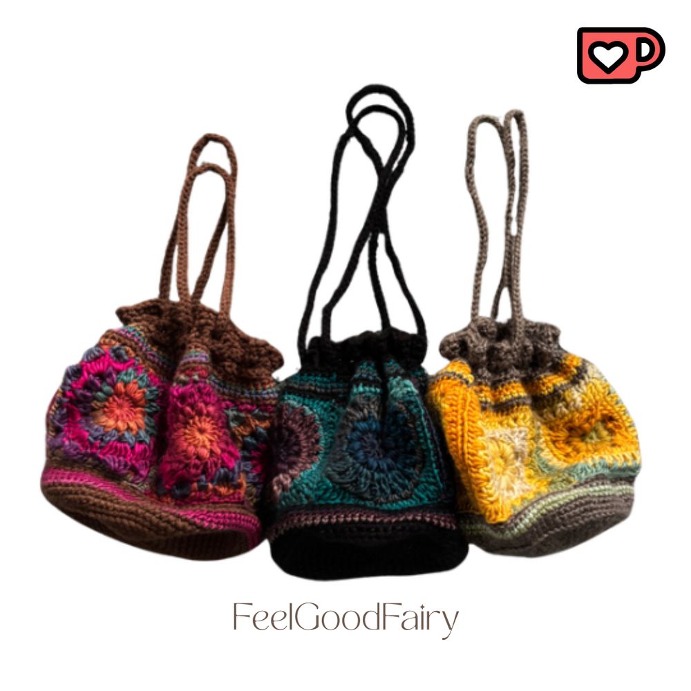 A product image of three crochet drawstring bags. From left to right the colors are: 

Spectrum: Magenta pink/burnt orange/blue/brown

Dark Ocean: Purple/blue/grey/black 

Coastal: Golden yellow/white/blue/grey