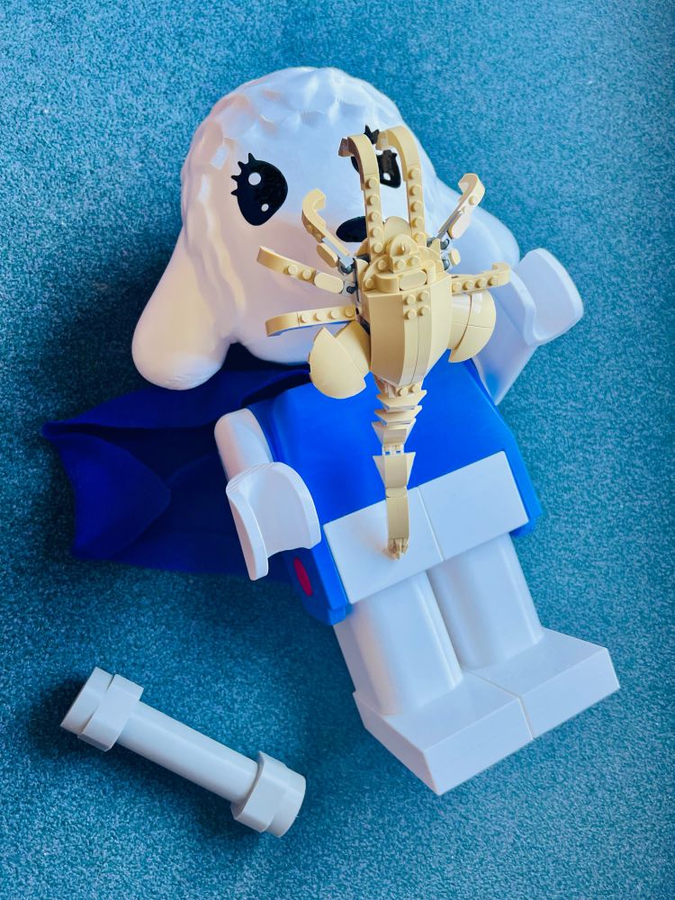 Giant Fabuland lamb being attacked by an Alien face hugger.