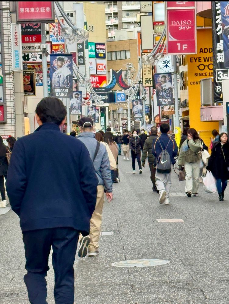 People in a busy shopping district. 