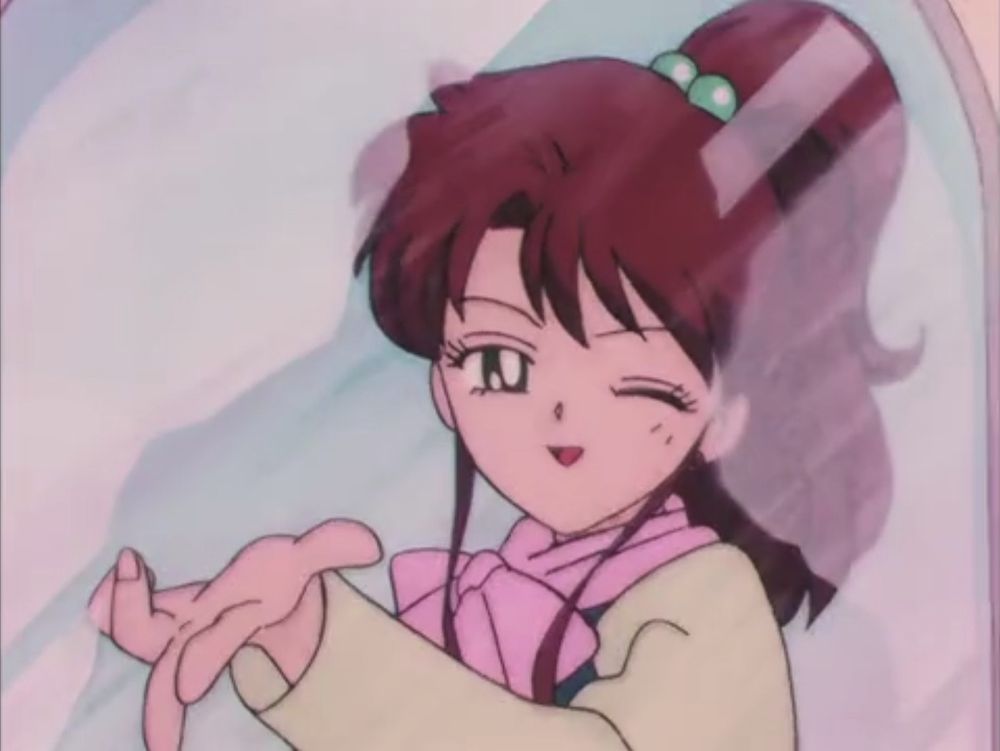 Makoto blowing a kiss with a wink