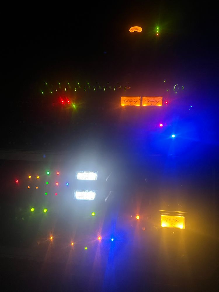 Home studio analog gear glowing in the dark.