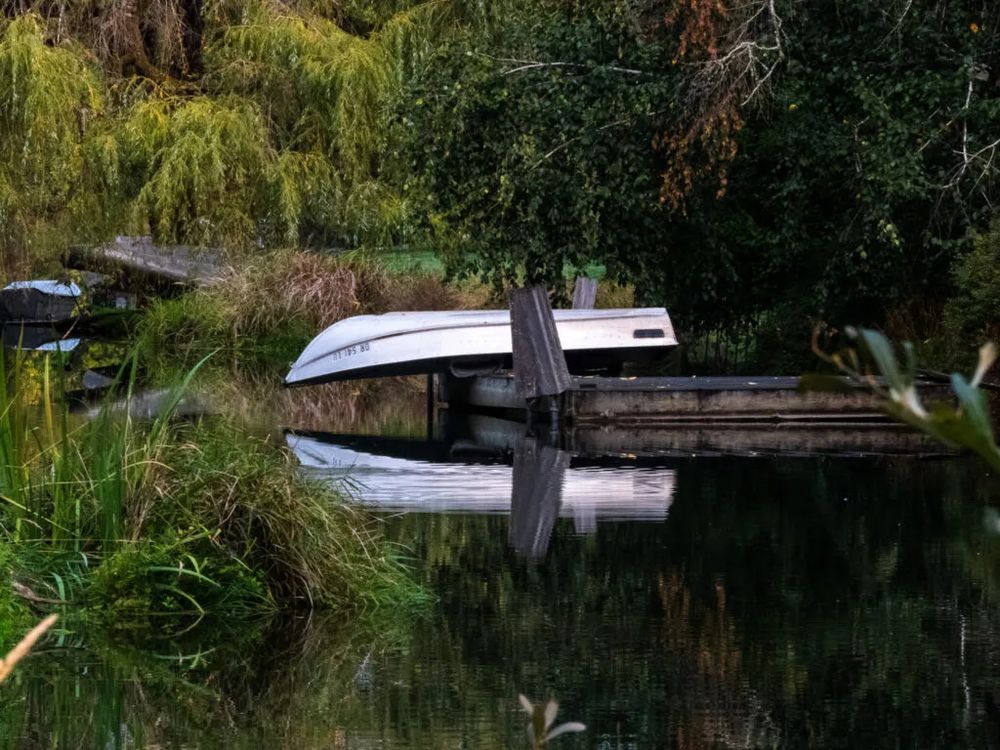 book reflecting on mill race pond