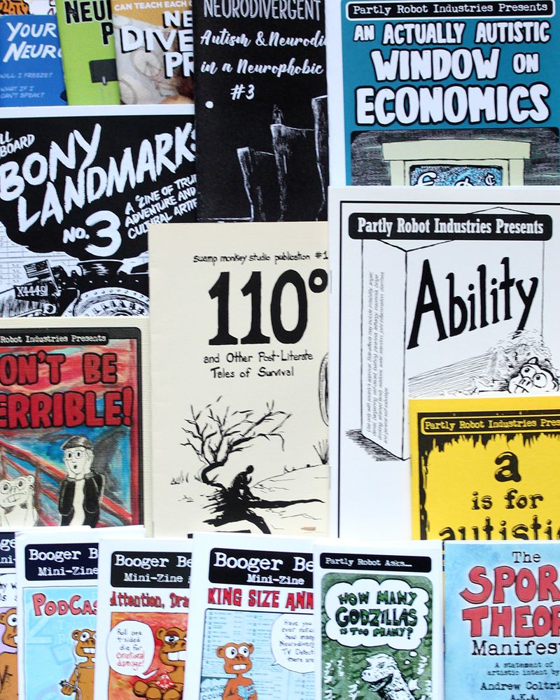 Photograph of zines featuring work by Andrew Coltrin/Partly Robot.
