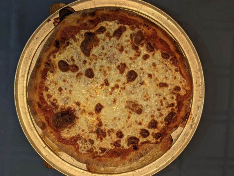 A top-down look at a homemade mozzarella pizza.