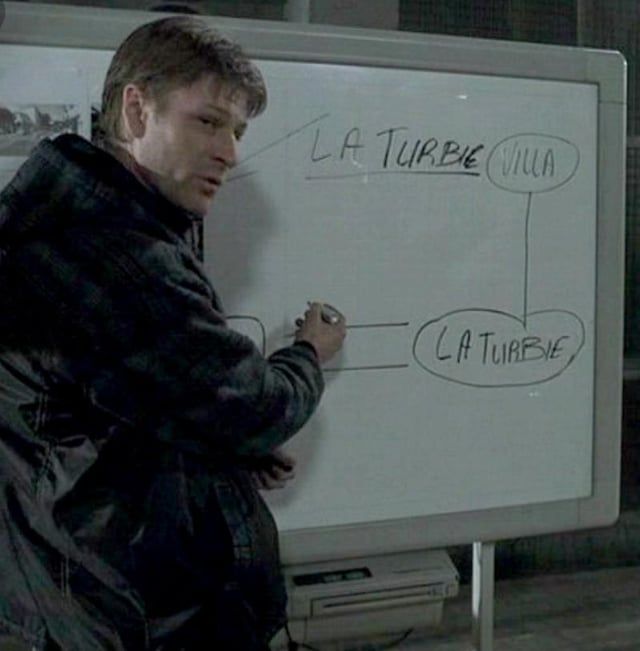 Sean Bean in RONIN, drawing on a whiteboard