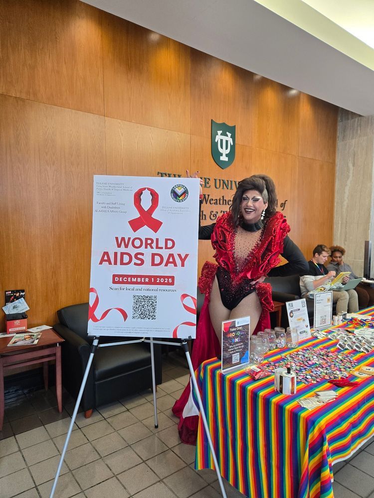 Debbie with a D poses at World AIDS Day tabling.
