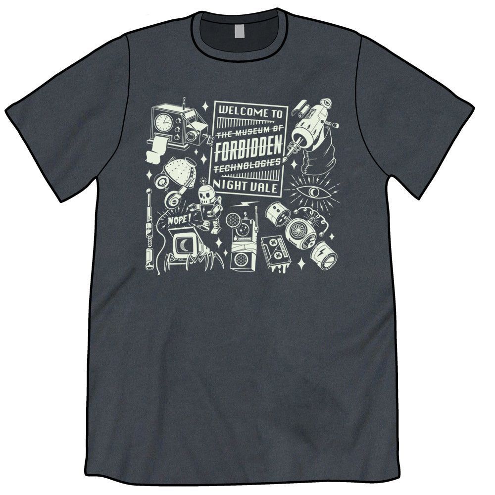 A slate gray t-shirt with a white design on the front: There are various technologies scattered around. In the middle is a large rectangle with "Welcome to" at the top and "Night Vale" at the bottom. In the middle are the words "The Museum of Forbidden Technologies" and the entire name has been struck through.
