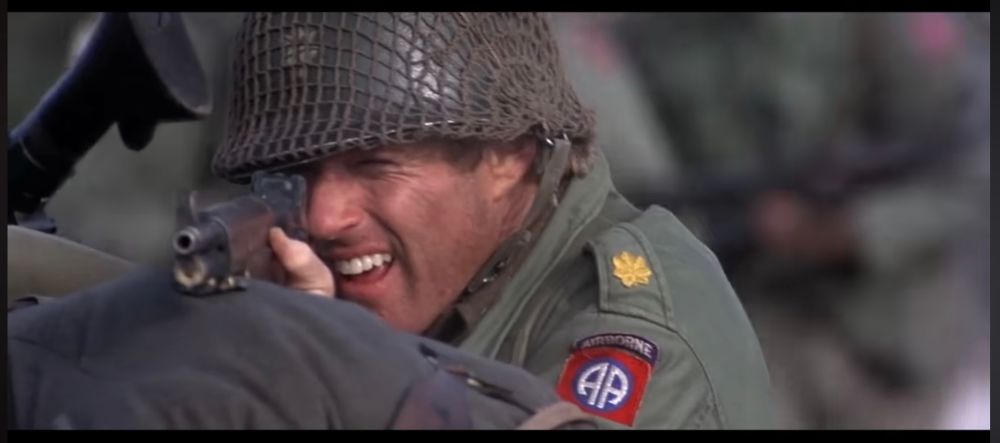 Still from "A Bridge too Far" in which soldier Robert Redford takes aim at some Nazis