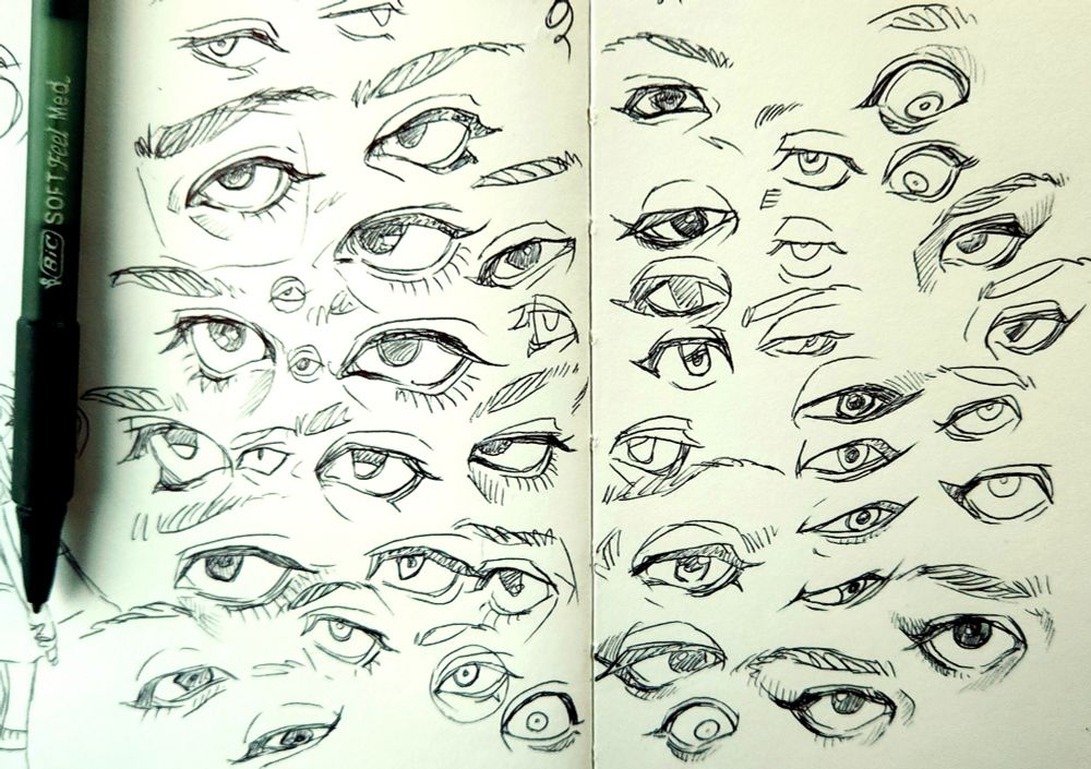 A bunch of ballpoint pen sketches of eyes