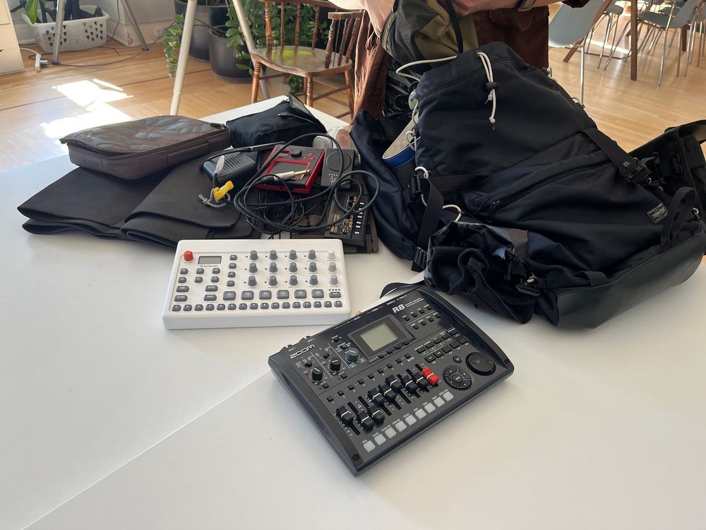 Pile of Alex's synths on the desk