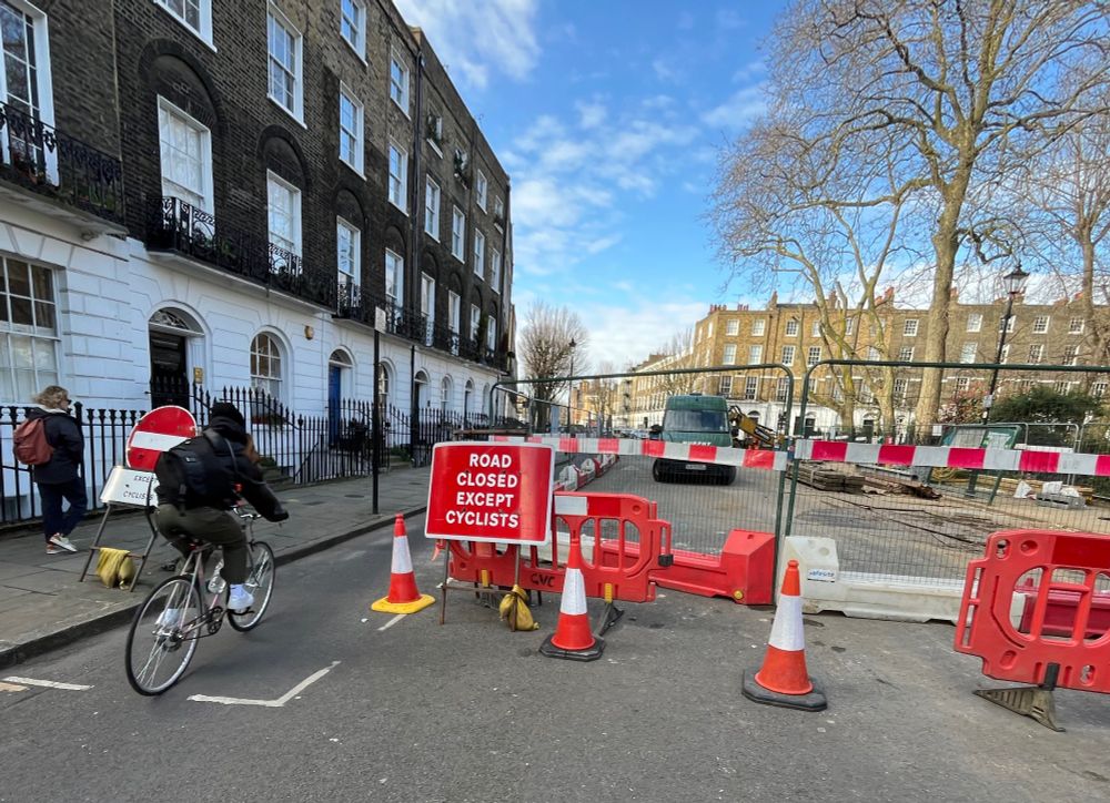 Street works road closure with a sign saying "road closed except cyclists"
