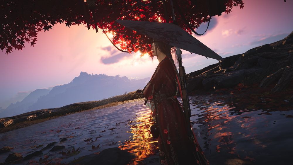 Screenshot from Where Winds Meet. A woman holding an umbrella looks off into the distance. She is standing on stones upon a shallow pool, underneath a canopy of red maple leaves. Behind her is soft daybreak. 