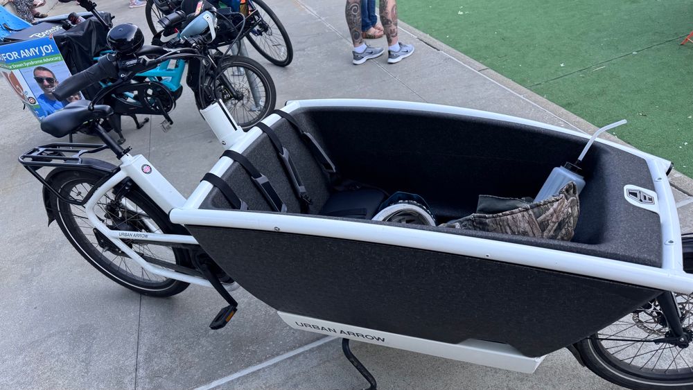 Photo of an Urban Arrow cargo bike in the foreground with a Tern GSD behind it to the left.