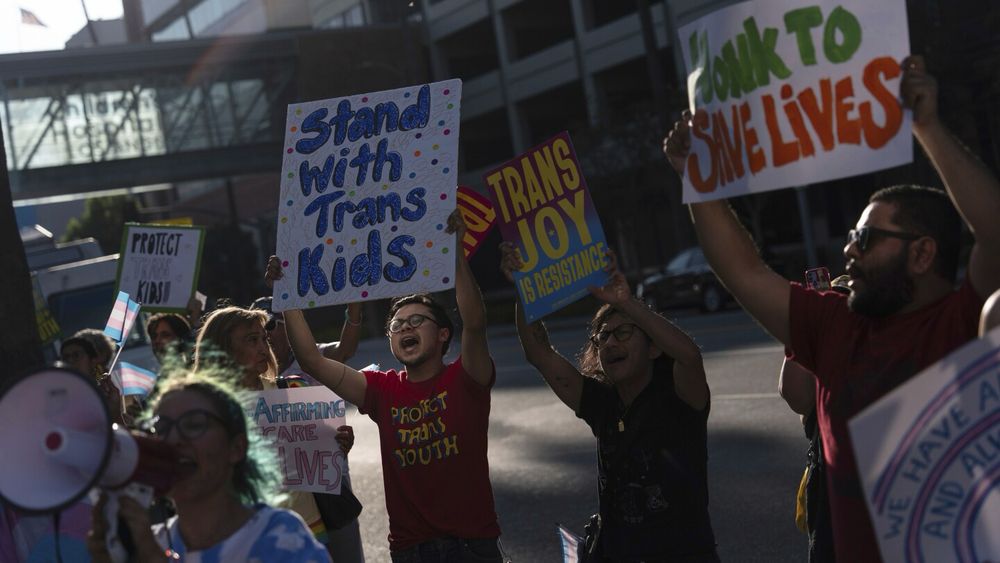 Democratic attorneys general and others are accusing President Donald Trump of intimidating hospitals into dropping gender-affirming care for transgender youth.