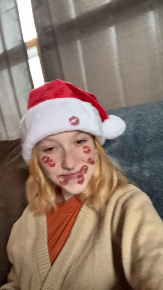 A picture of me smiling in a Santa/father Yule hat.