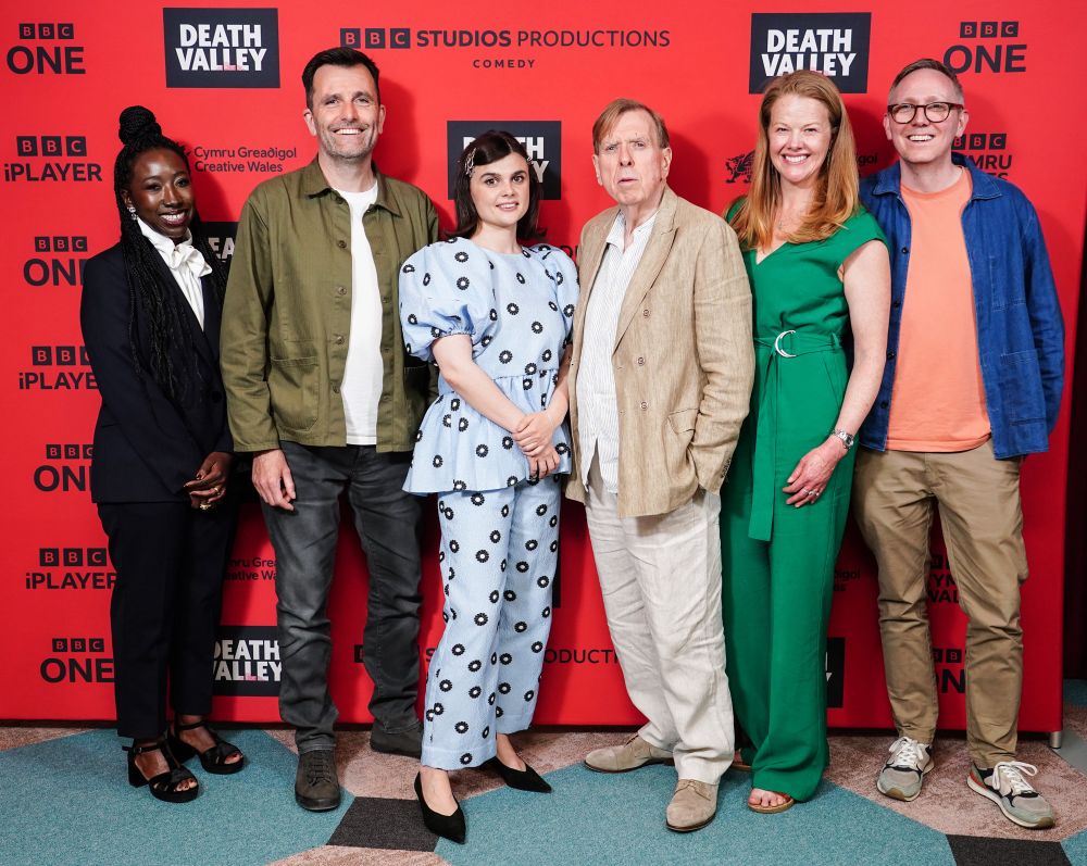 Publicity photo of cast and crew of Death Valley. 