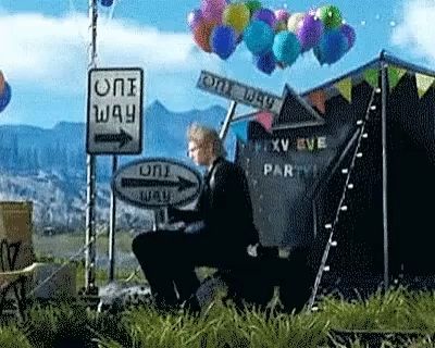 a man sitting in front of a one way sign