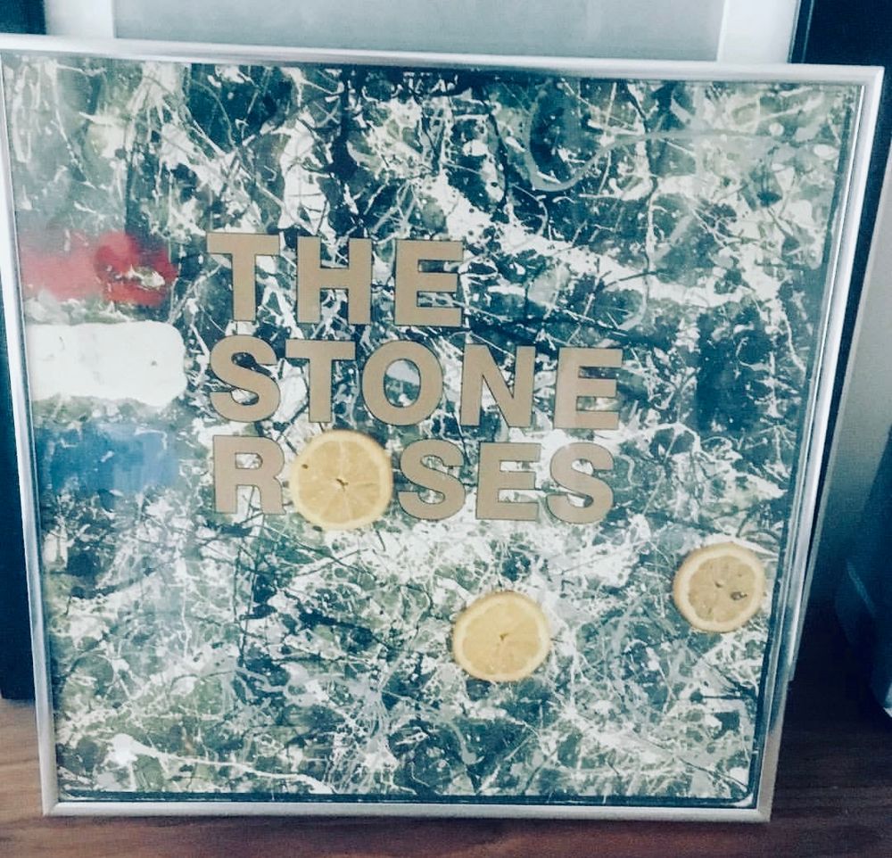 The album cover of the stone roses debut in a frame 