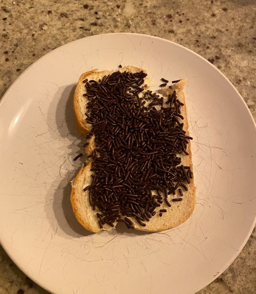 white bread with butter and chocolate sprinkles 