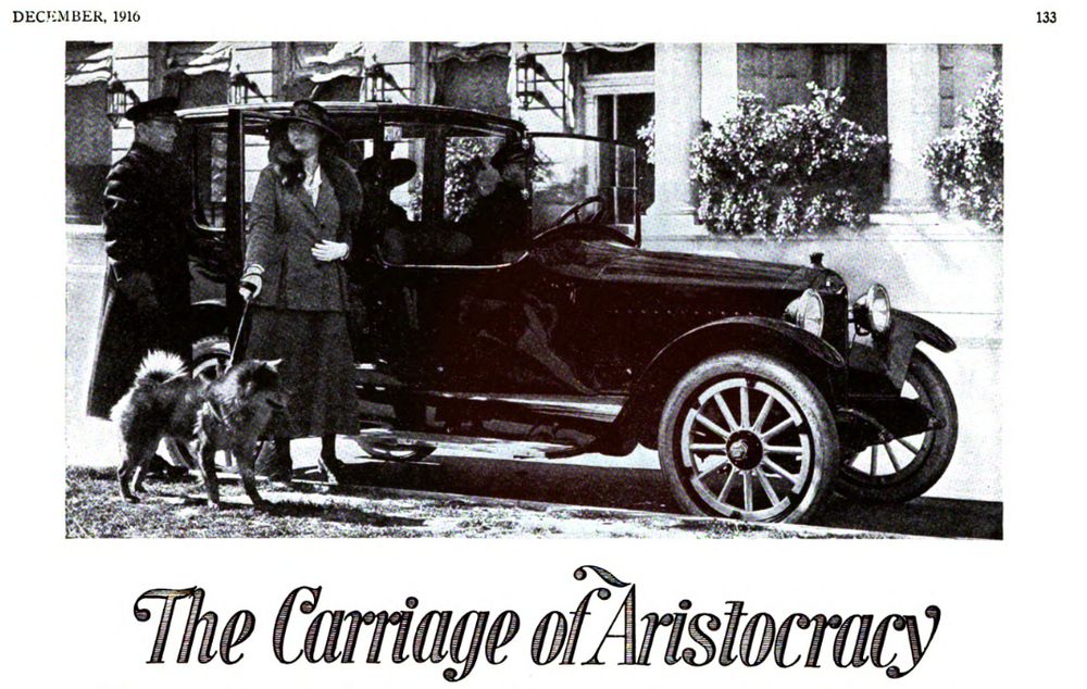 A black-and-white advert for an automobile, with a society woman and her dog being shown in by their chauffeur. The caption reads: "Carriage of the Aristocracy"