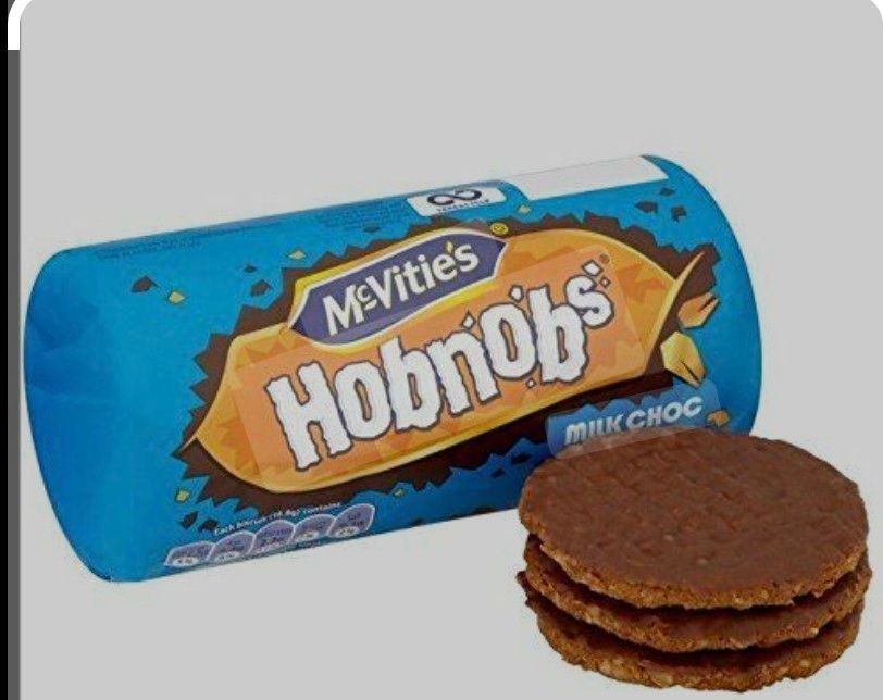 Pic of a blue package and a stack of three chocolate hobnob cookies/biscuits