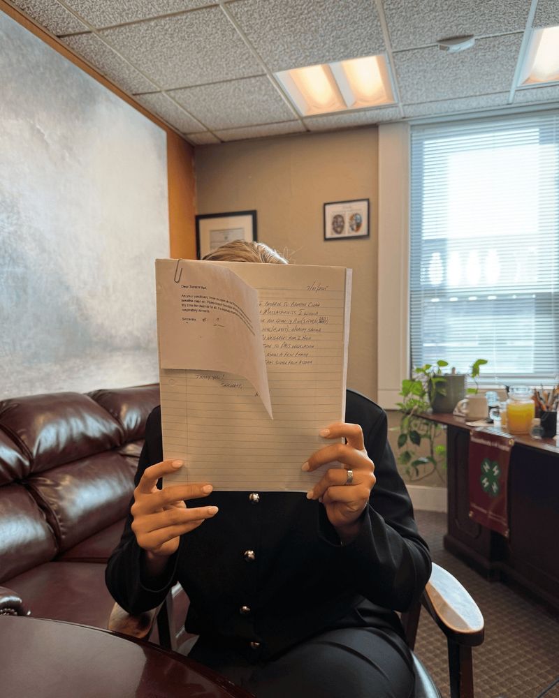 A staffer holds up a pile of letters
